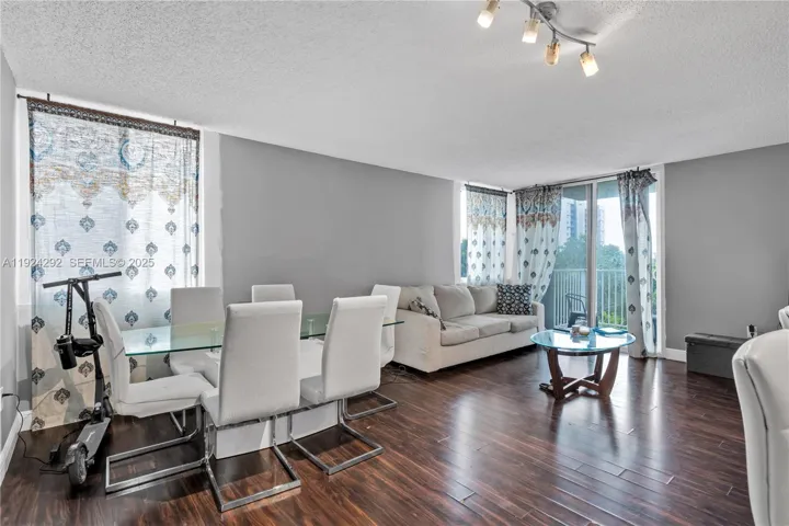 open living/dining area overlooking the balcony
