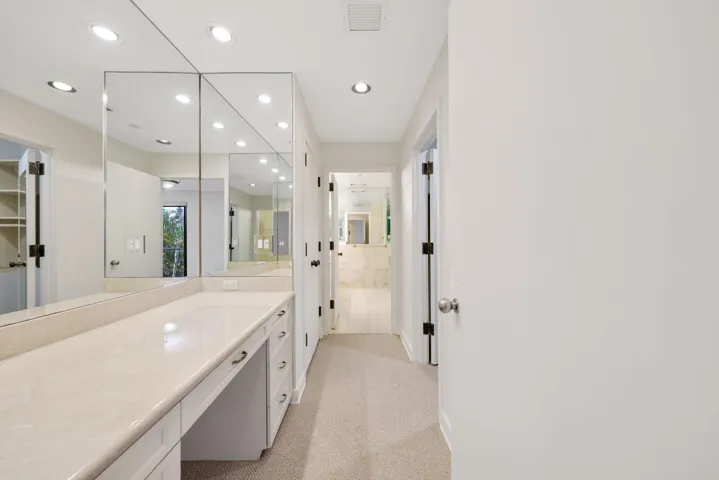 Primary Suite Makeup Area/Multiple Closets/Path to His/Her En-Suite Bathroom
