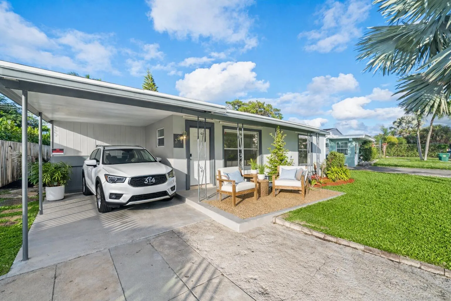 Front porch and carport virtually staged