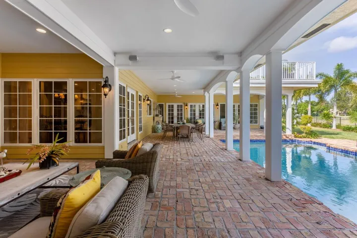 Large covered patio and open pool area