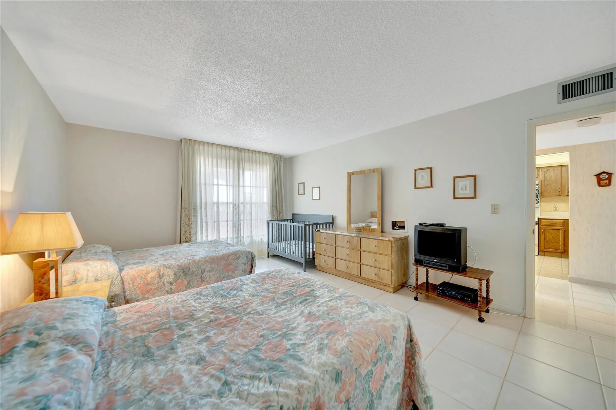 Huge Guest Bedroom and Entrance Into The Kitchen on right.
