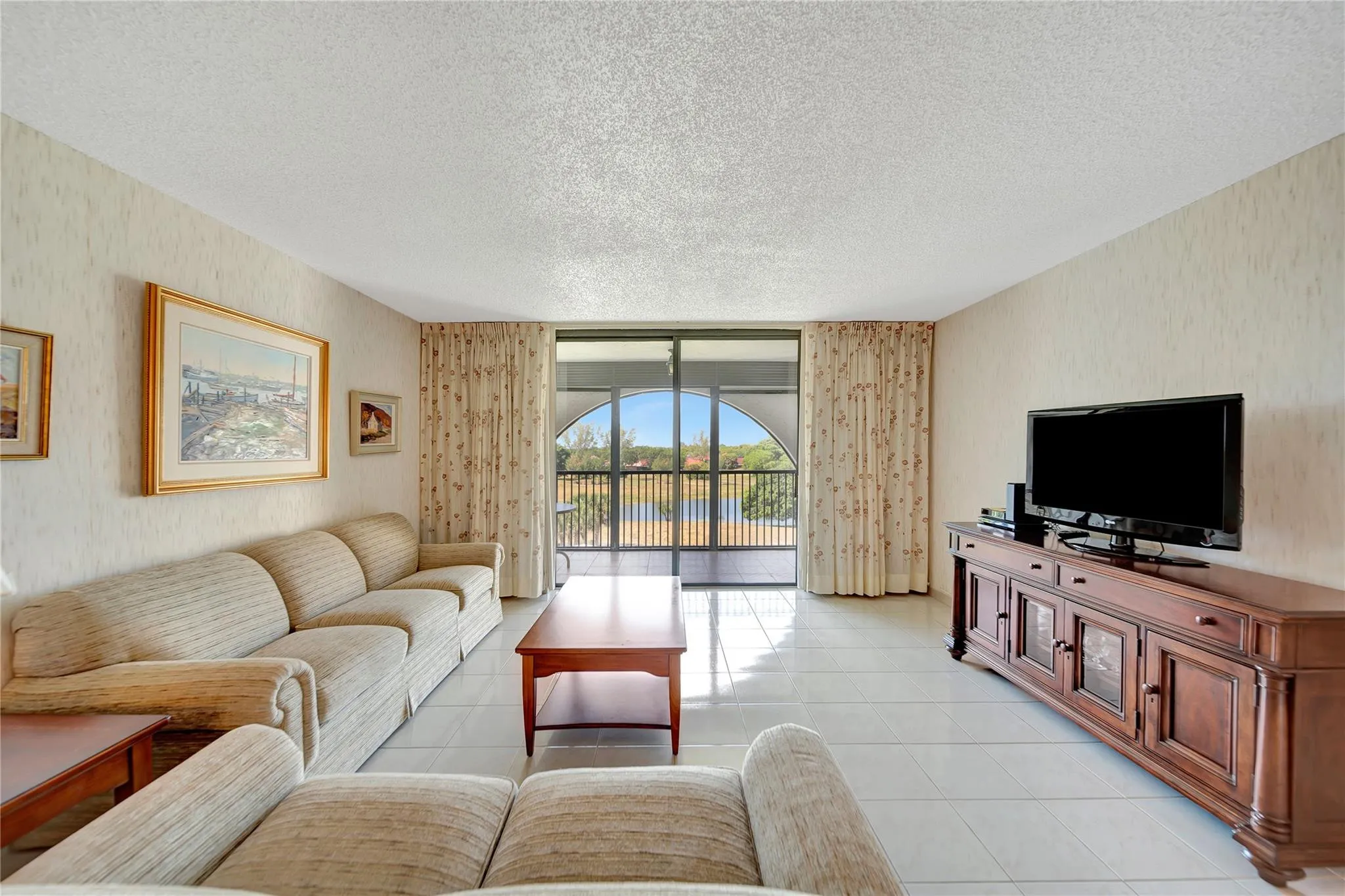 Spacious Living Room with Patio Doors to Screened Balcony