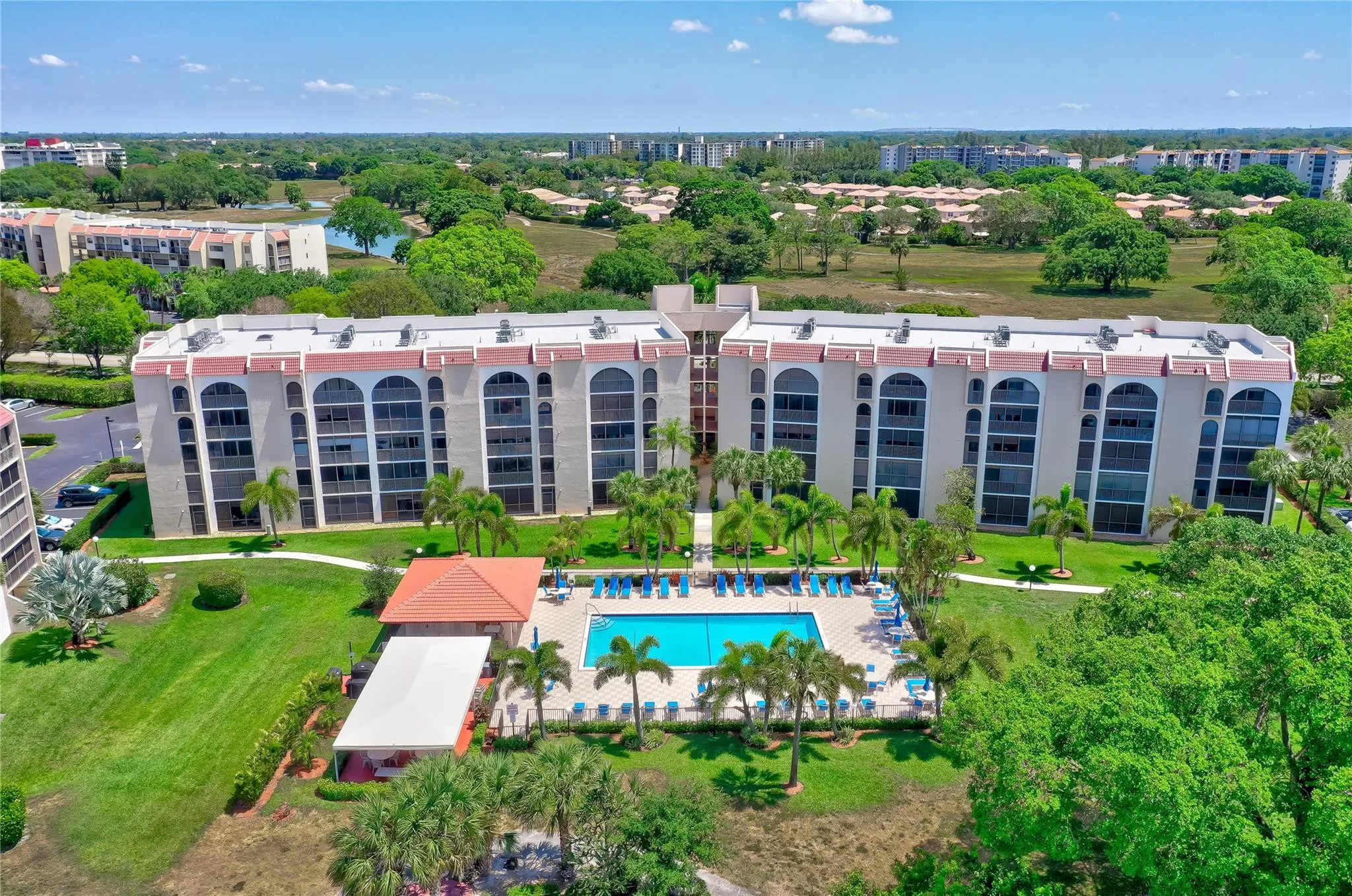 Spectacular Lakes of Environ Building With Brand New Roof & New Paint located next to Newly Renovated Heated Pool, New Pool Furniture and Newly Renovated Pool House