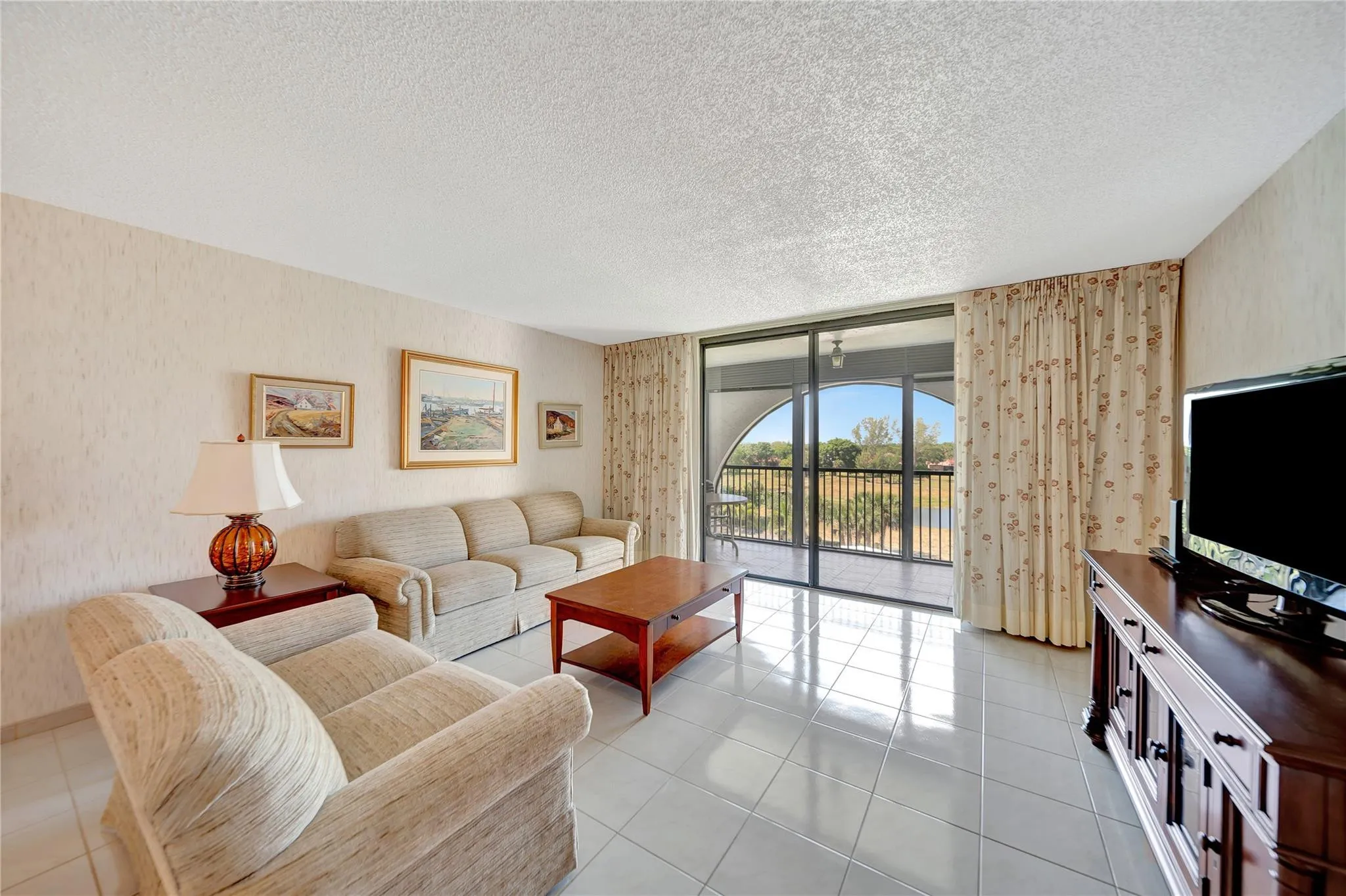 Spacious Living Room with Patio Doors to Large Screened Balcony