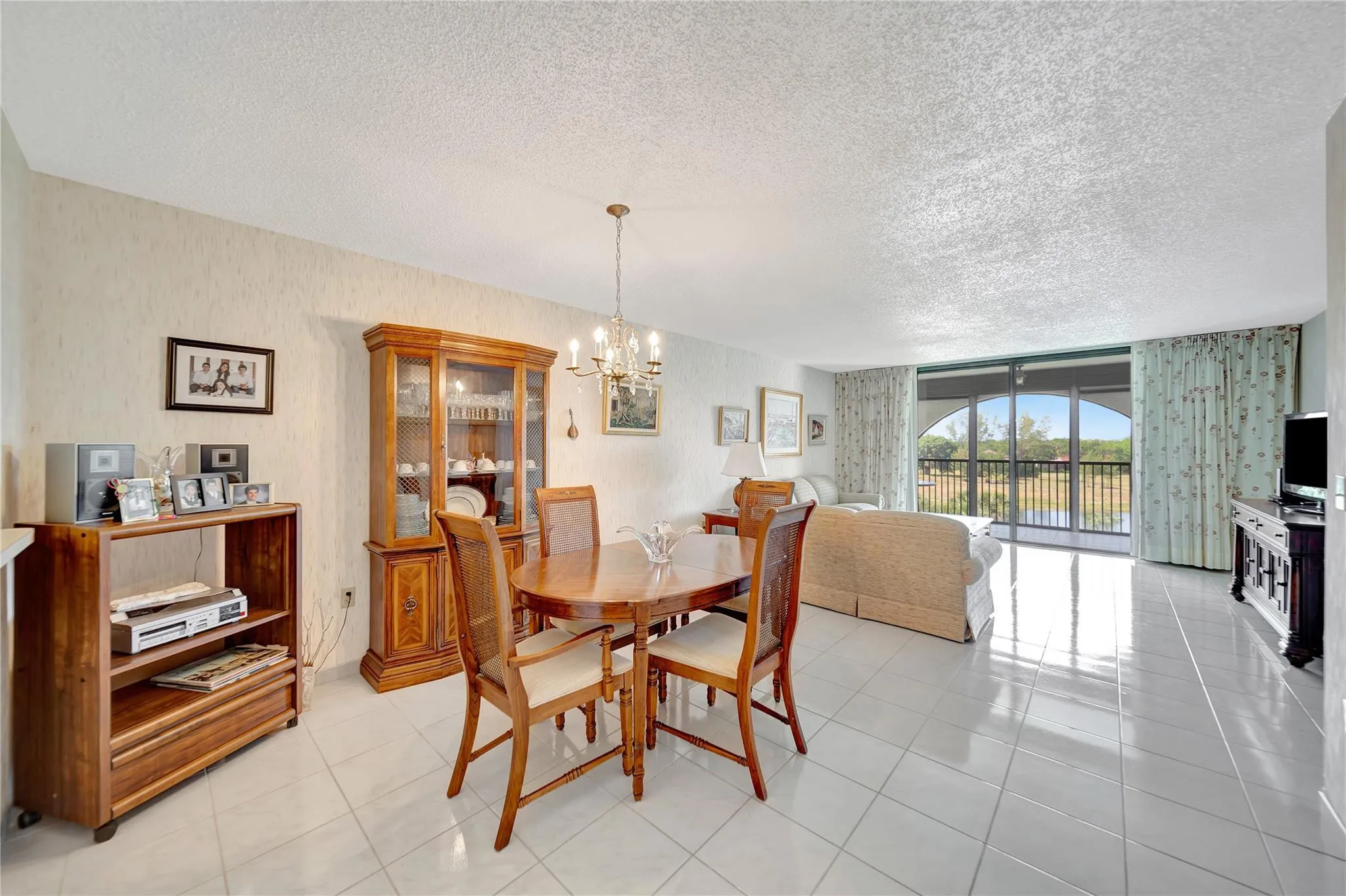 Spacious Living Room & Dining Room with Patio Doors to Screened Balcony