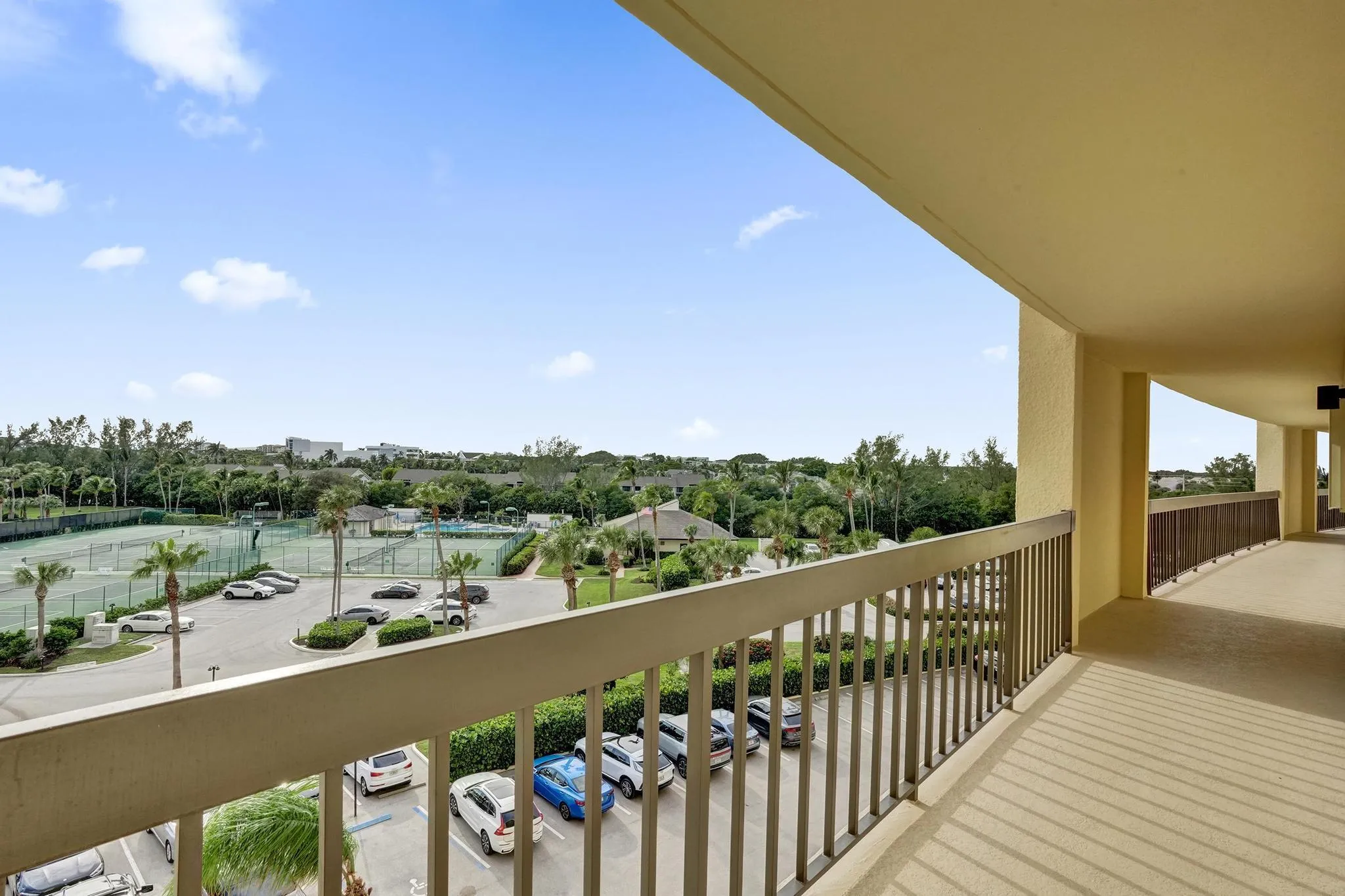 Tennis/Pickleball Courts + Pool located on the West side of the Building.