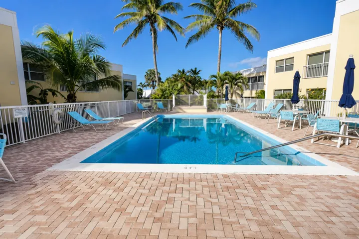 Beautifully maintained community pool just steps from the private beach.