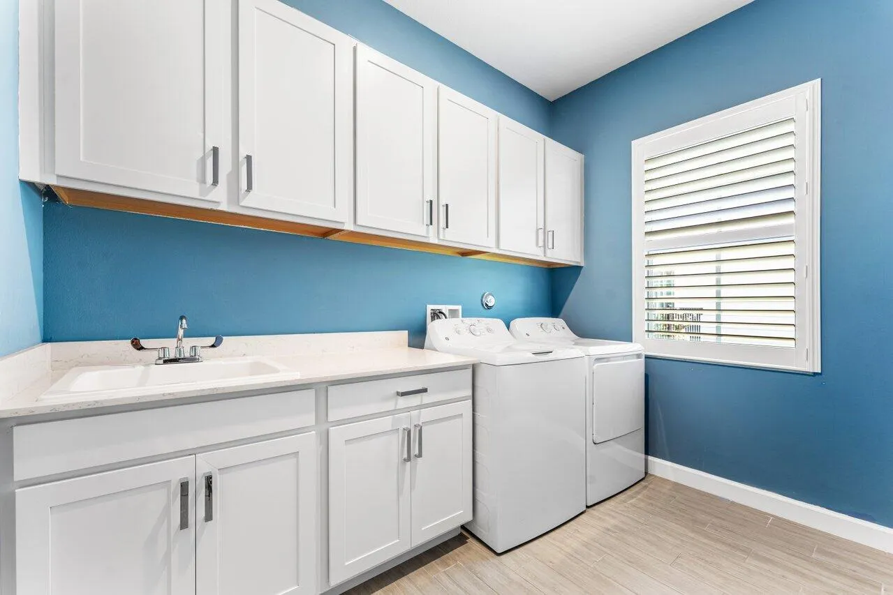 Laundry room-cabinets, sink, and window