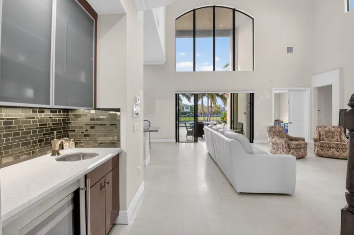 MARBLE FLOORS THRUOUT DOWNSTAIRS LOOK STRAIGHT OUT INTO THE POOL AND LAKE