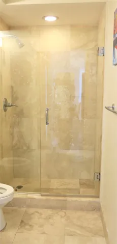 Guest Bathroom - Italian stone shower with Glass shower enclosure