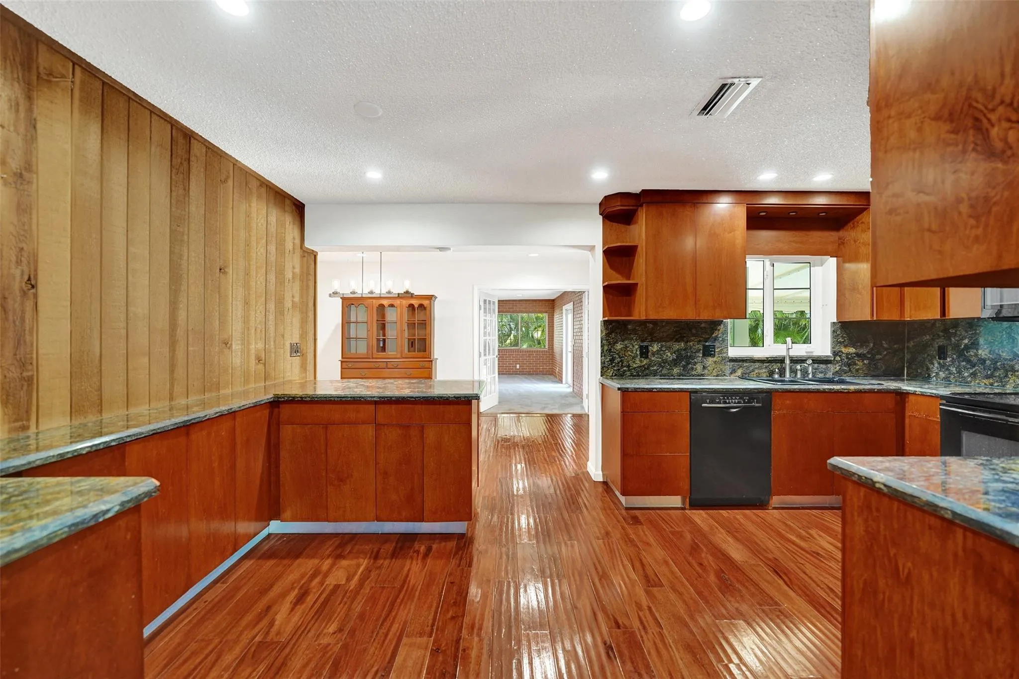 Spacious kitchen with breakfast counter.