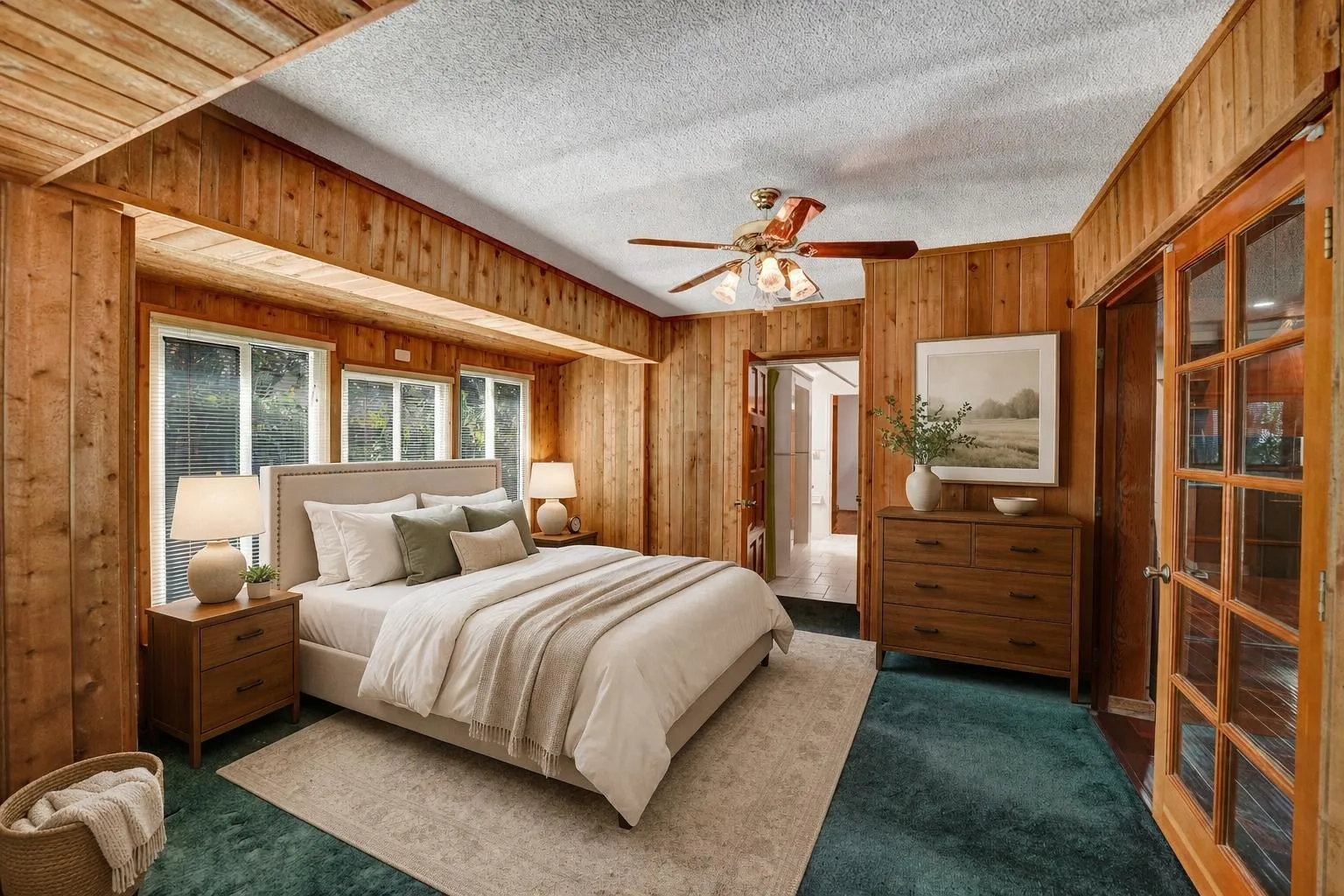 Bedroom virtually staged. Features include French doors and bay window.