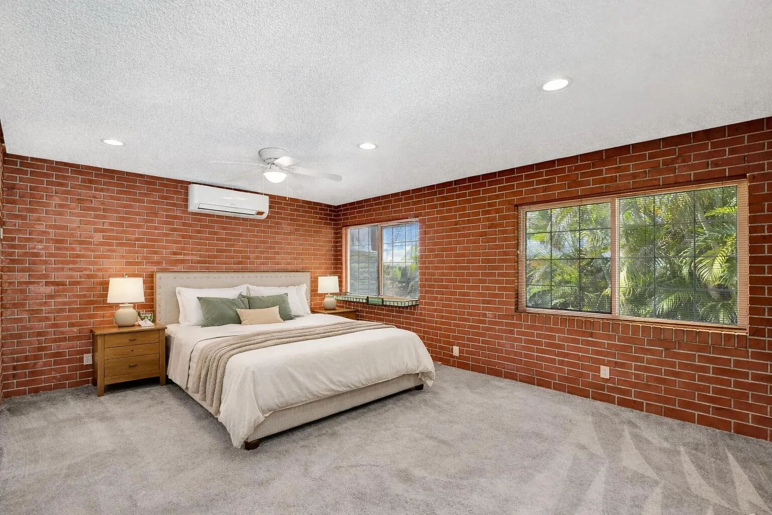 Large third bedroom/bath in-law suite with private entrance and pool views. Virtually staged.