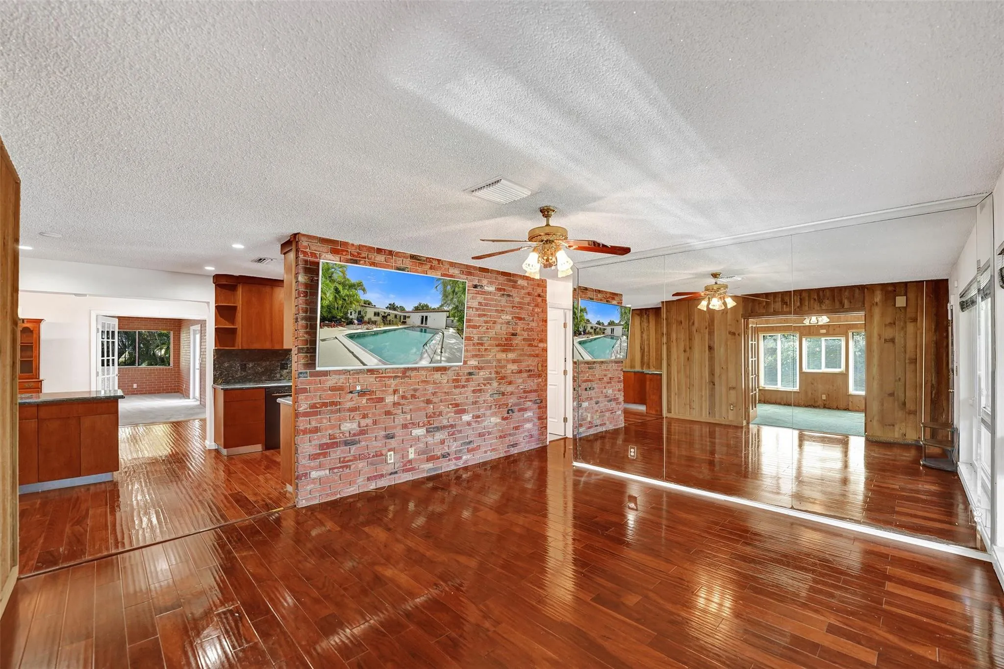 Living room with mirror on right wall