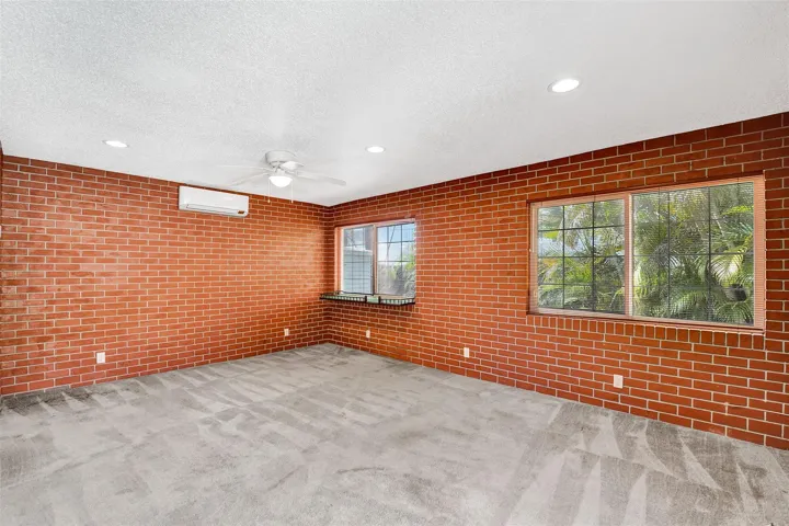 Large third bedroom/bath in-law suite with private entrance and pool views.
