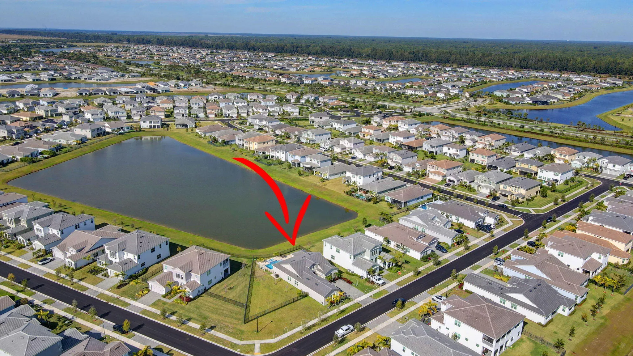 Waterfront property with a corner lot, private pool, and expansive green space