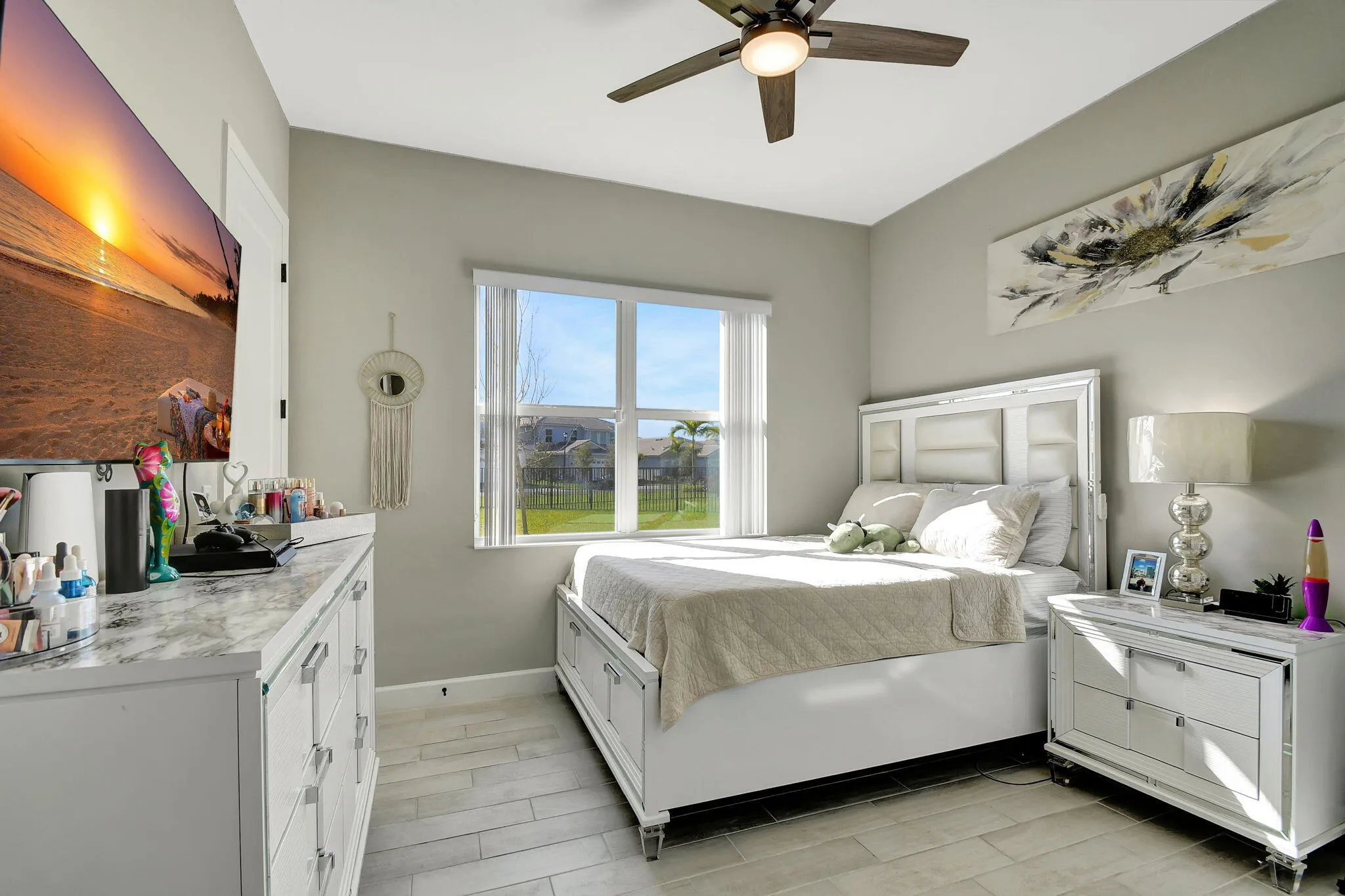 Recessed lighting, wood-finish flooring, ceiling fan, and a wide window