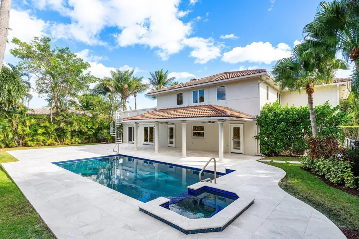 Large outdoor patio with pool and spa