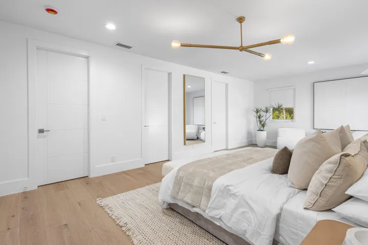 Primary Bedroom with 2 walk in closets and deck
