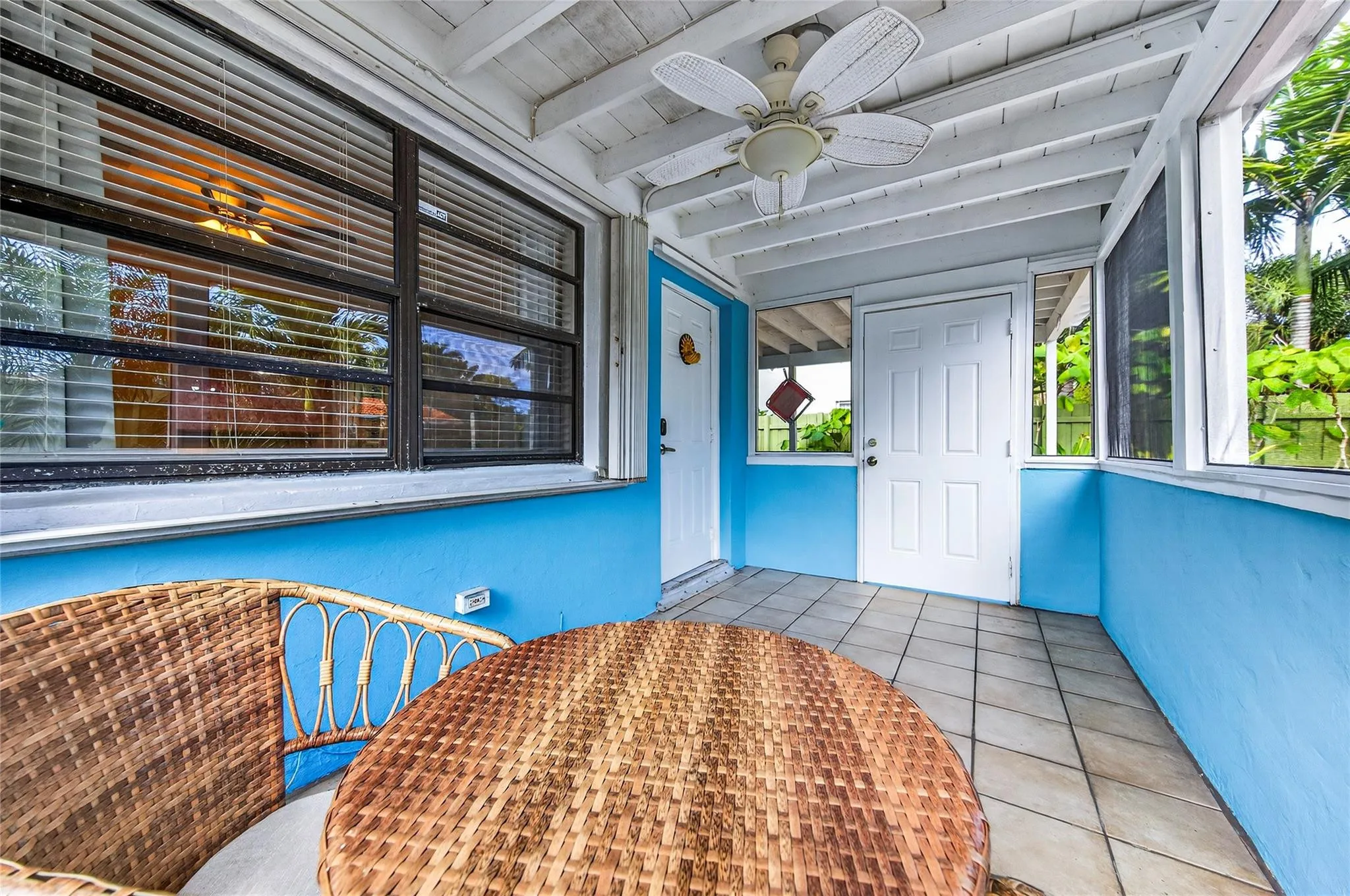 Screened in porch and front door to the left