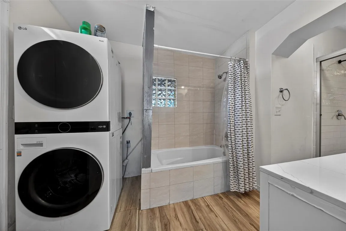 En suite primary bath and laundry