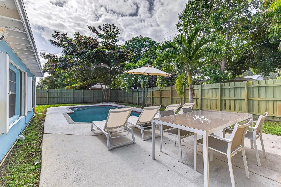 Backyard with dining and lounging areas