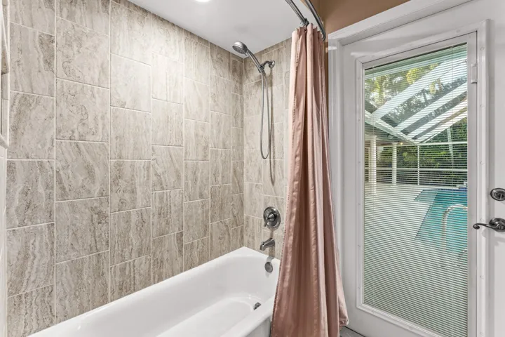 Guest bathroom with access to patio/pool area