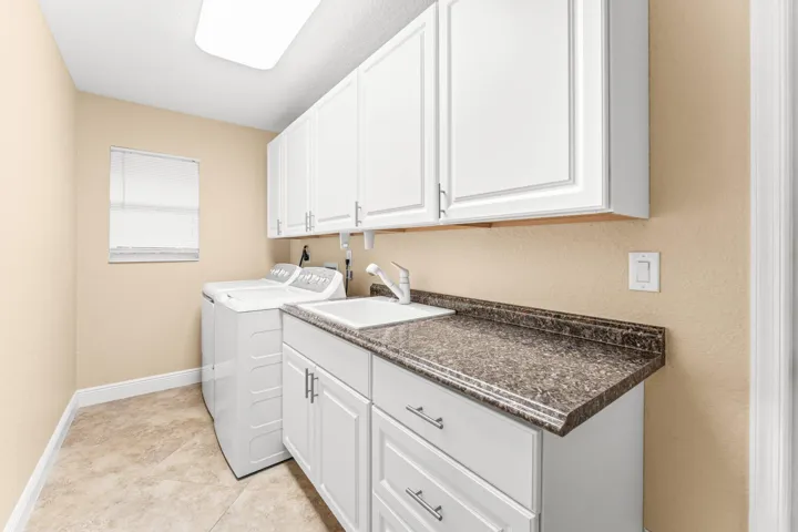Laundry room with full-size appliances