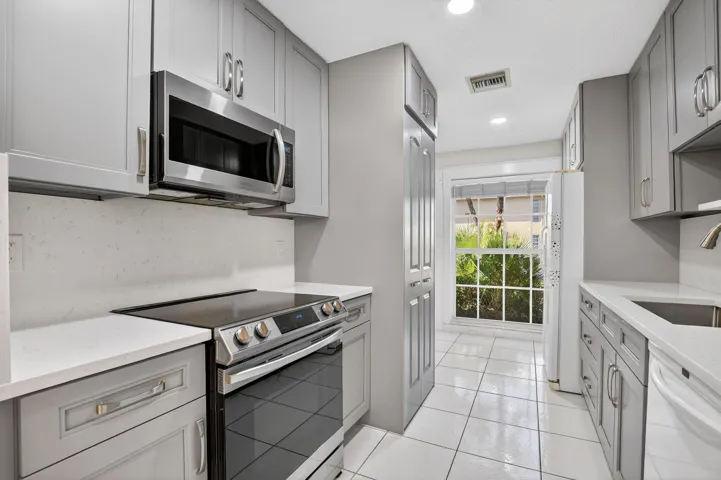 Contemporary kitchen with custom cabinetry and modern appliances.