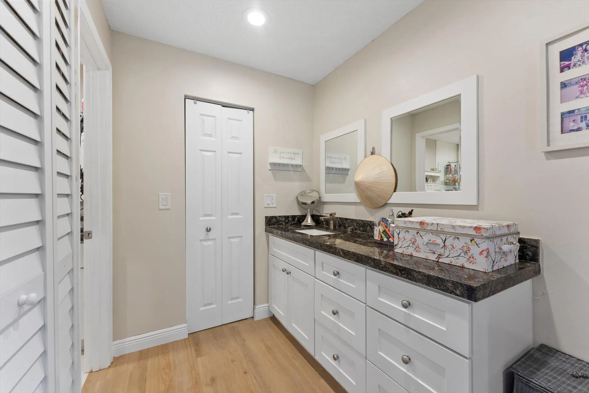 Dressing area with vanity and large walk-in closet