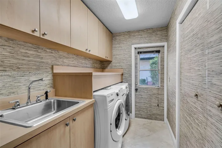 Laundry Room with closet