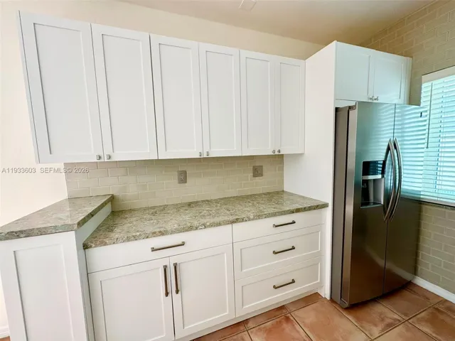 New Stone Countertop and Cabinets and Stainless Steel Appliances