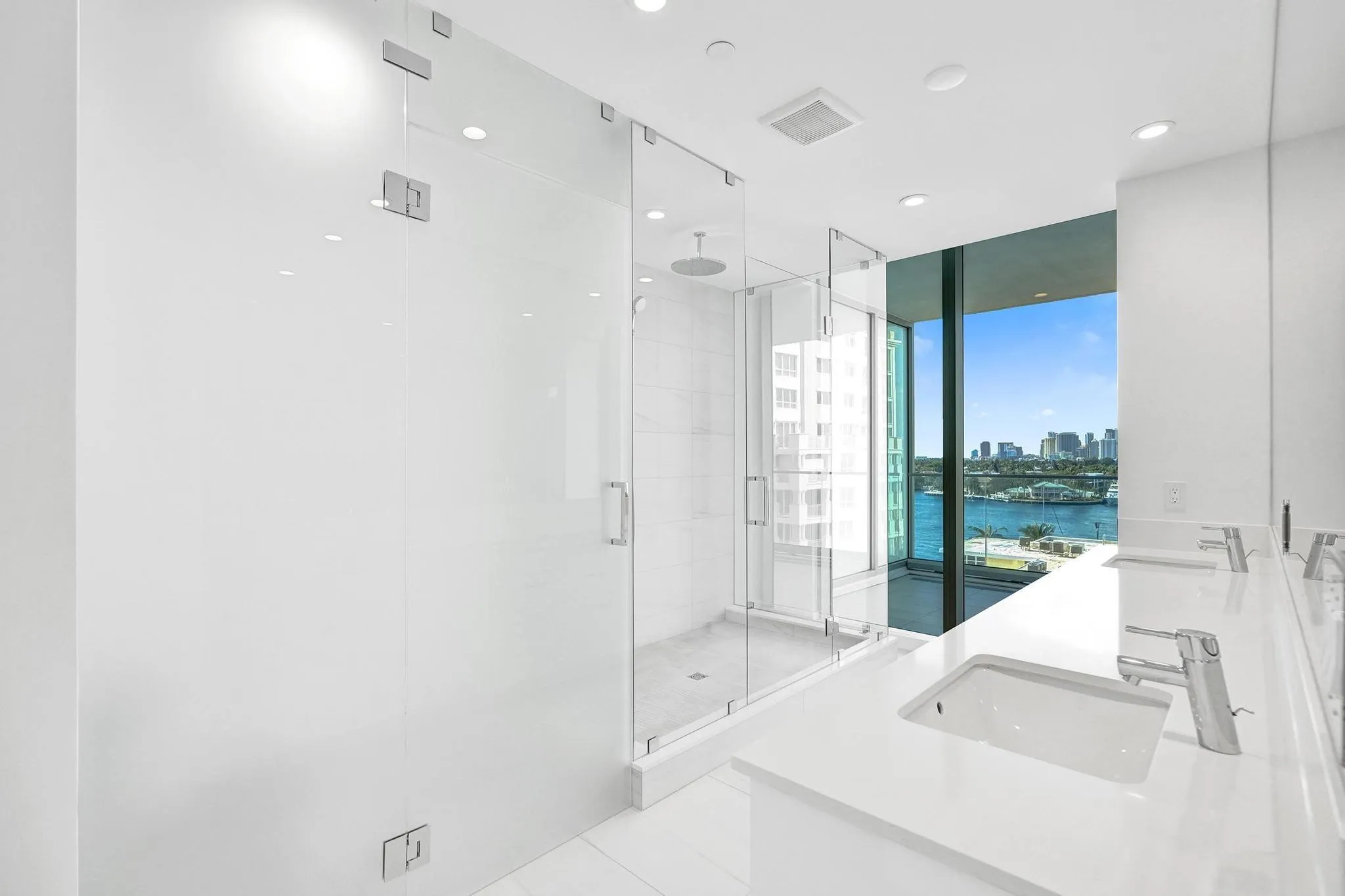 Primary bath features huge shower and dual sinks.