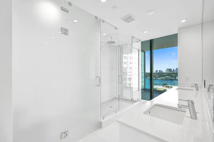 Primary bath features huge shower and dual sinks.