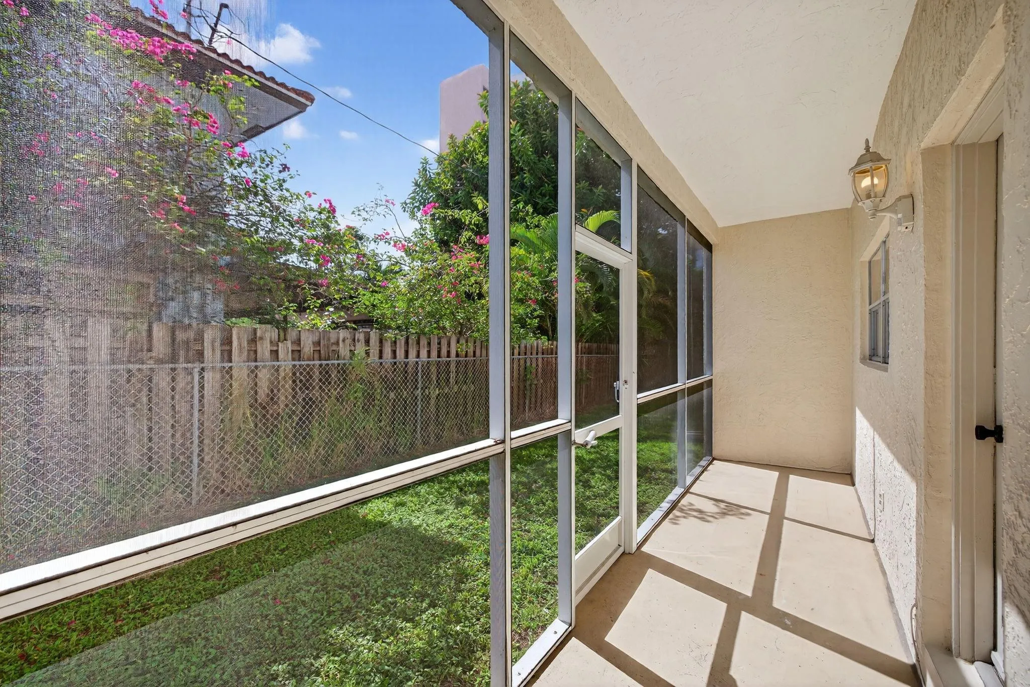 Enjoy the Florida weather year round on your private screened-in patio off the kitchen