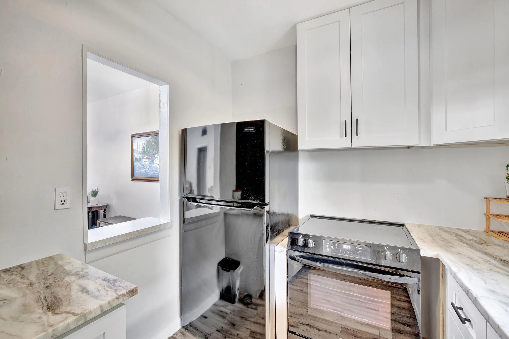 Kitchen with window overlooking dining/living area