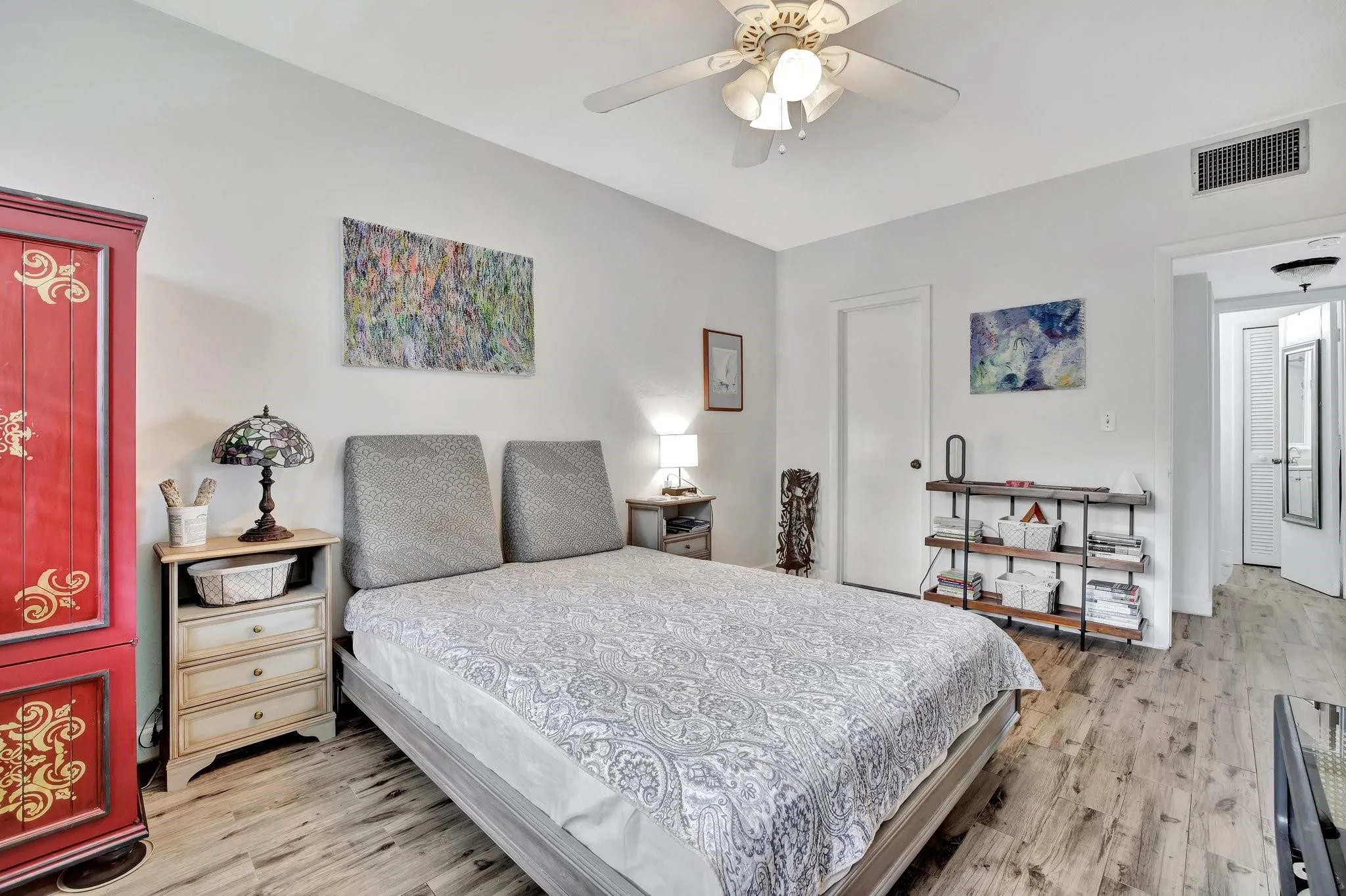 The oversized bedroom features a large walk-in closet