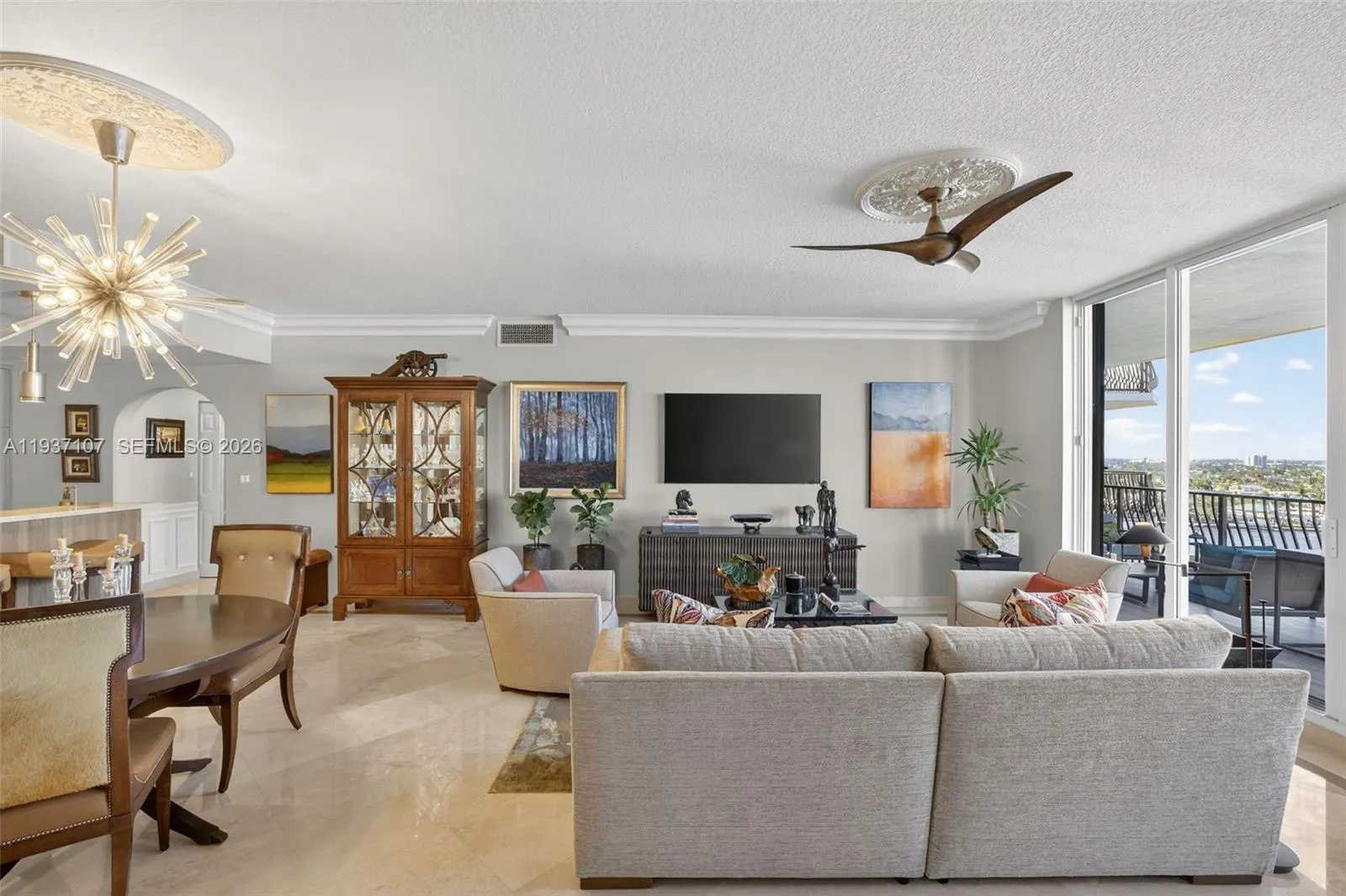 Marble flooring, water views, floor to ceiling glass, crown molding. Bright open and airy.
