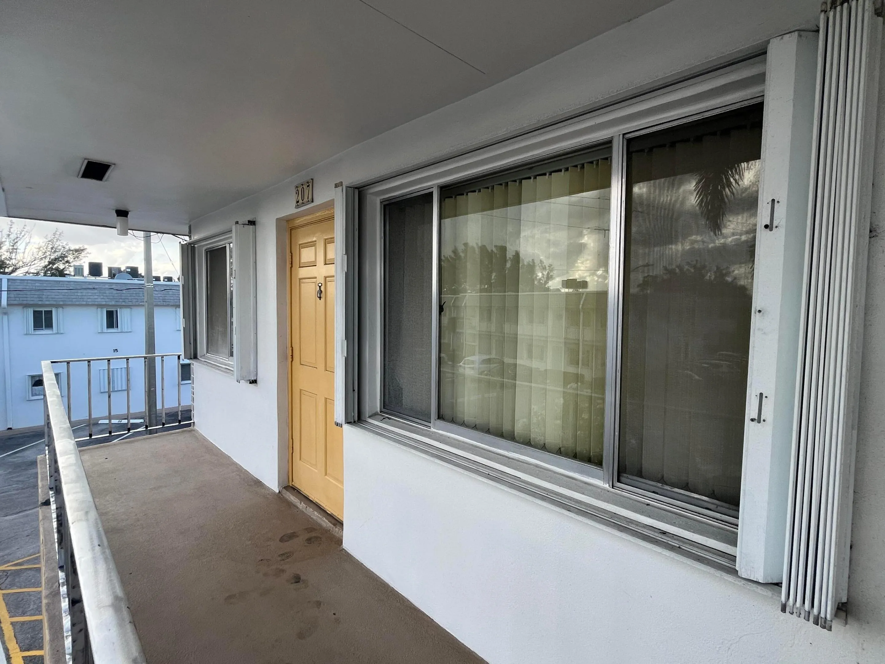 Corner unit with accordion shutters