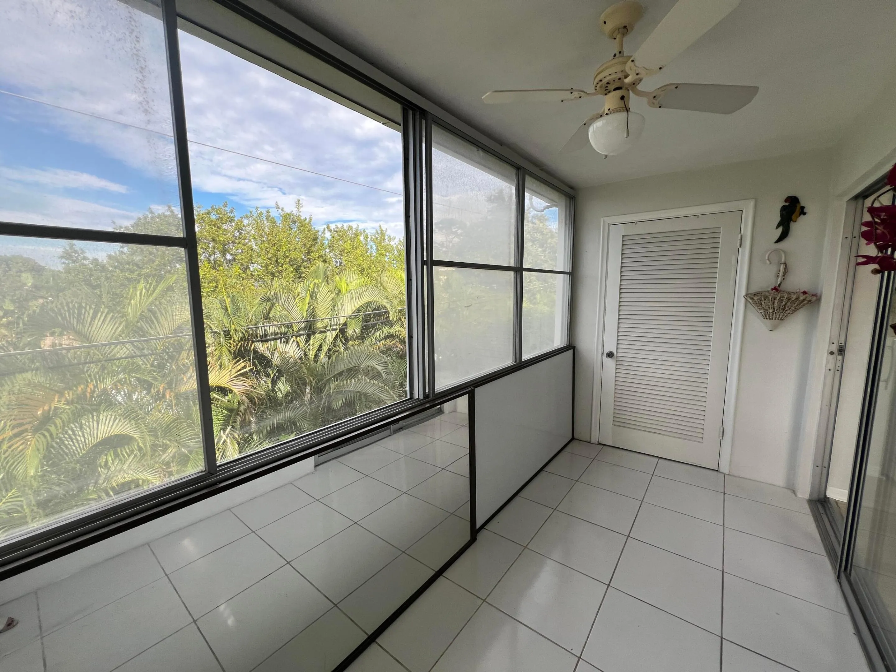 Covered & screened balcony with windows