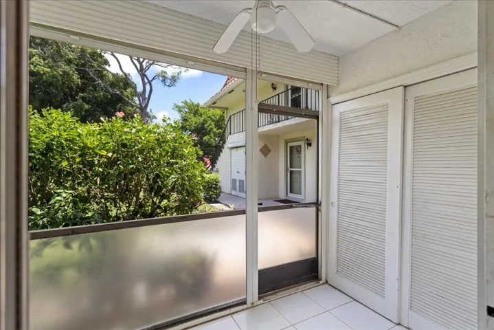 Screened and covered patio with garden view