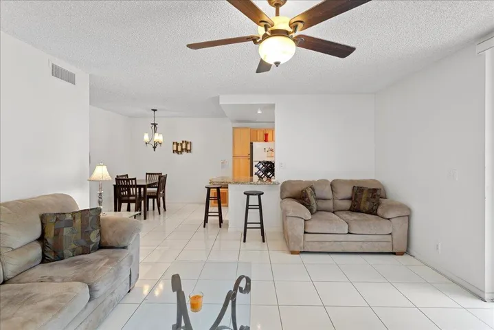 Spacious living area, ceiling fan and tile floors