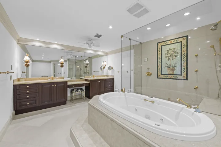 Extra large primary bathroom with dual sinks, spa tub, oversized dual shower