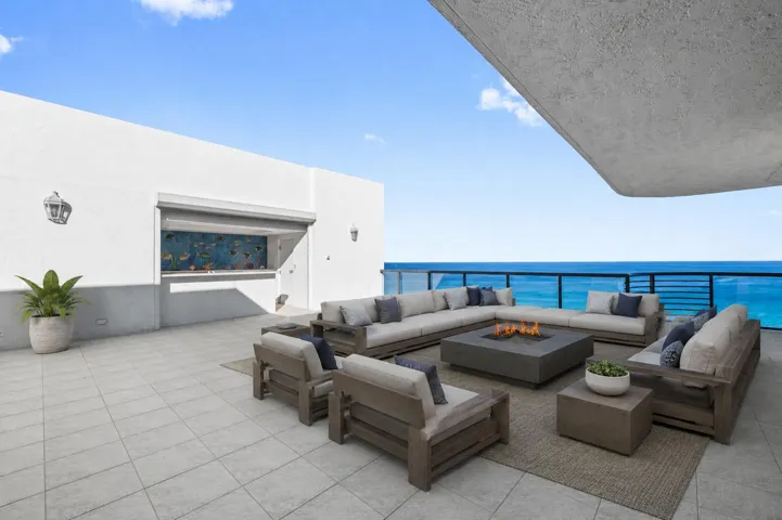Virtually staged to show a furnished space on the large private oceanfront terrace