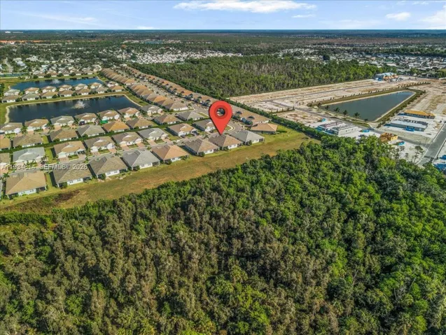 view of property location with nearby suburban area and a arge body of water