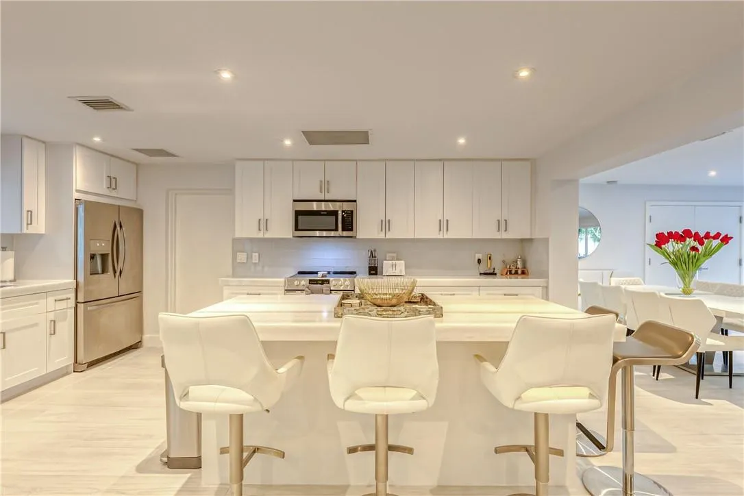 Marble Island bar with 5 barstools and expansive chef's kitchen.