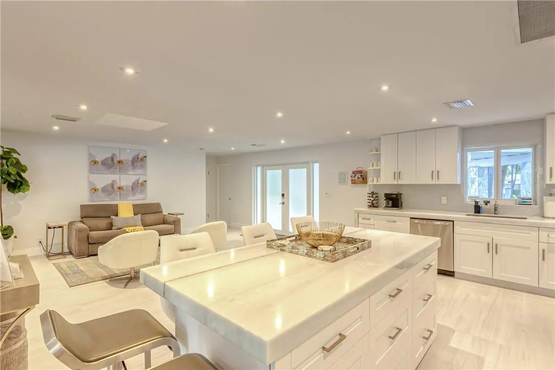 Marble Island bar with 5 barstools and expansive chef's kitchen.