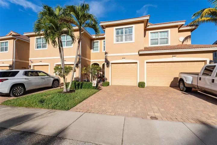 ONE CAR GARAGE WITH PAVER DRIVEWAY