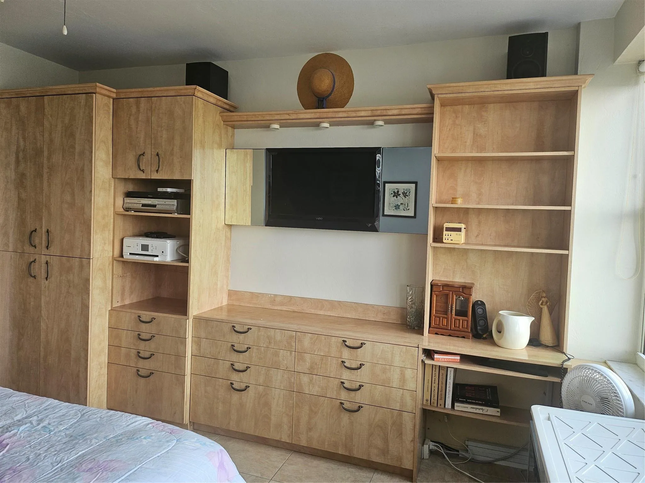 customed wall unit for extra storage , electronics stay