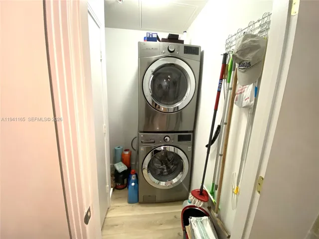Stackable washer and dryer in the kitchen area.